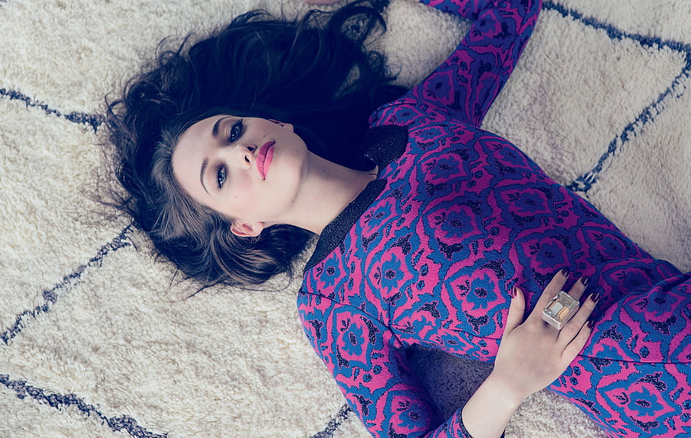 woman wearing blue and red floral dress and lying on white textile HD wallpaper
