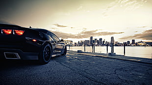 black luxury car photo during sunset