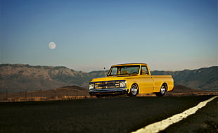 yellow single cab pickup truck along highway during daytime HD wallpaper