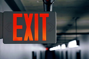 white and orange exit signage