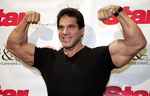 man wearing black t-shirt showing biceps