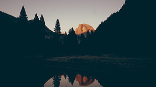 landscape photo of mountain and lake during golden hour