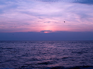 sunset over horizon, sea