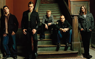 five man wearing black jackets