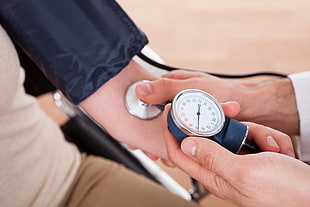 man taking blood pressure
