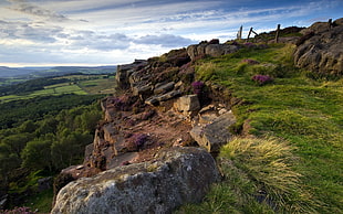 brown rocks on edge of mountain during sunset
