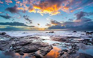 landscape view of ocean horizon, blue sky and white clouds during sunset photography