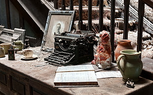 black typewriter near ceramic vases on table HD wallpaper
