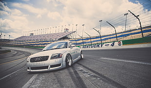 silver Audi coupe on racetrack