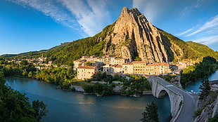 green and gray mountain, town, bridge, river, hill