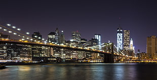 photography of bridge with light at nighttime, brooklyn bridge HD wallpaper