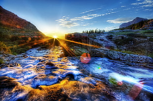 time lapse photography of river with stones under blue sky HD wallpaper