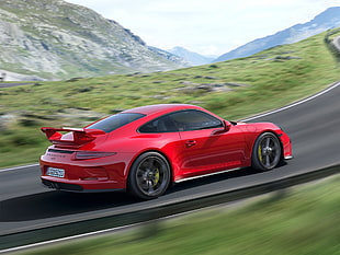 red sports coupe traveling on the road HD wallpaper
