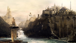 gray castle on cliff beside body of water under cloudy sky during daytime