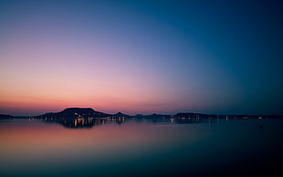 silhouette of mountains by the water at sunset photography, nature, landscape, sky, sea