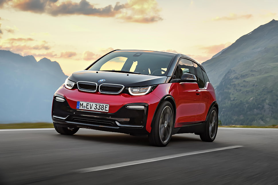 red and black BMW i3 running on road HD wallpaper