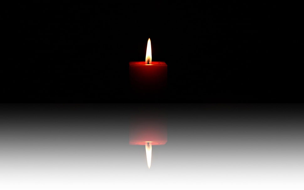 candle on dark spot HD wallpaper