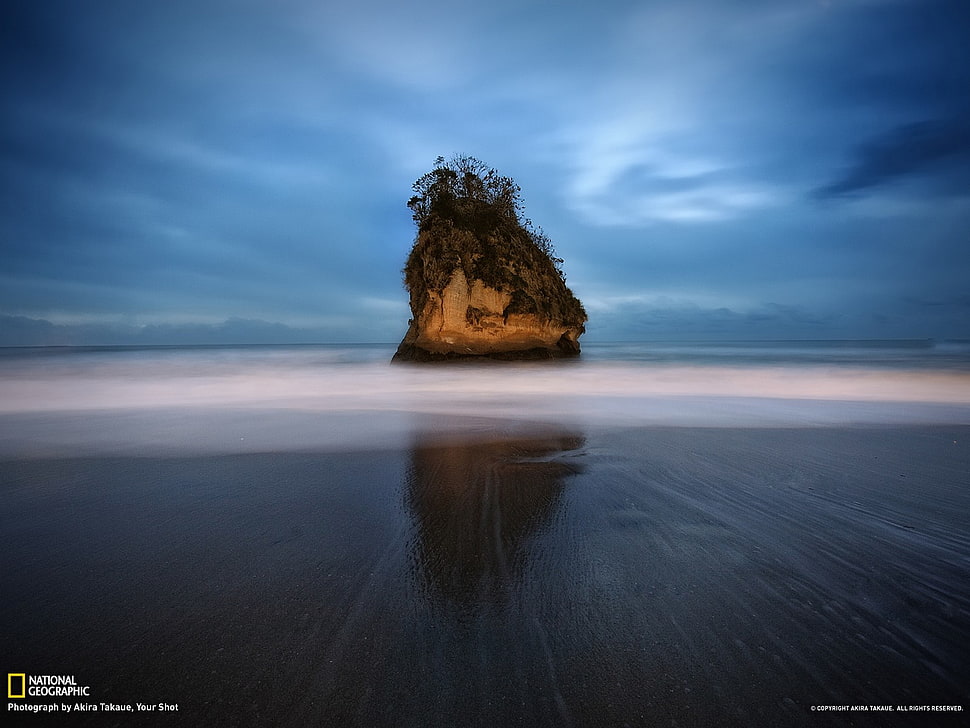 brown rock monolith, landscape, beach, island, National Geographic HD wallpaper