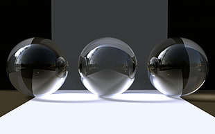 three glass ball decors