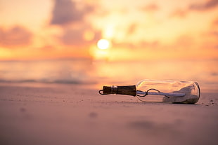 selective focus photography wishing bottle during sunset