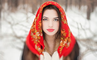 selective focus photography of woman wearing red and brown floral headscarf during winter