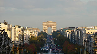 concrete arc landmark, clouds, trees, Paris, France