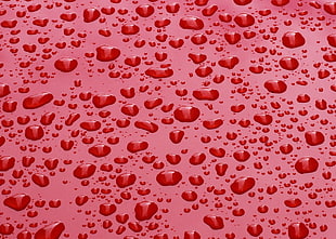 red surface with water droplets