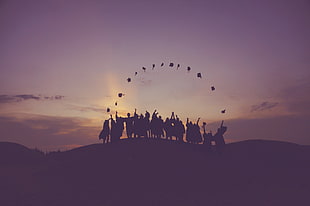 silhouette photo of group of people throwing their academic hat during golden hour HD wallpaper