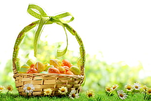 brown wicker basket with assorted-color eggs