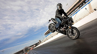 black sports bike, motorcycle, stunts