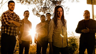 six men group photo during golden hour