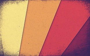 close-up photo of yellow, orange, red, and purple painted wall