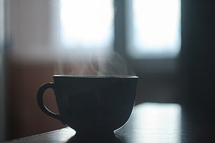 black cup on table