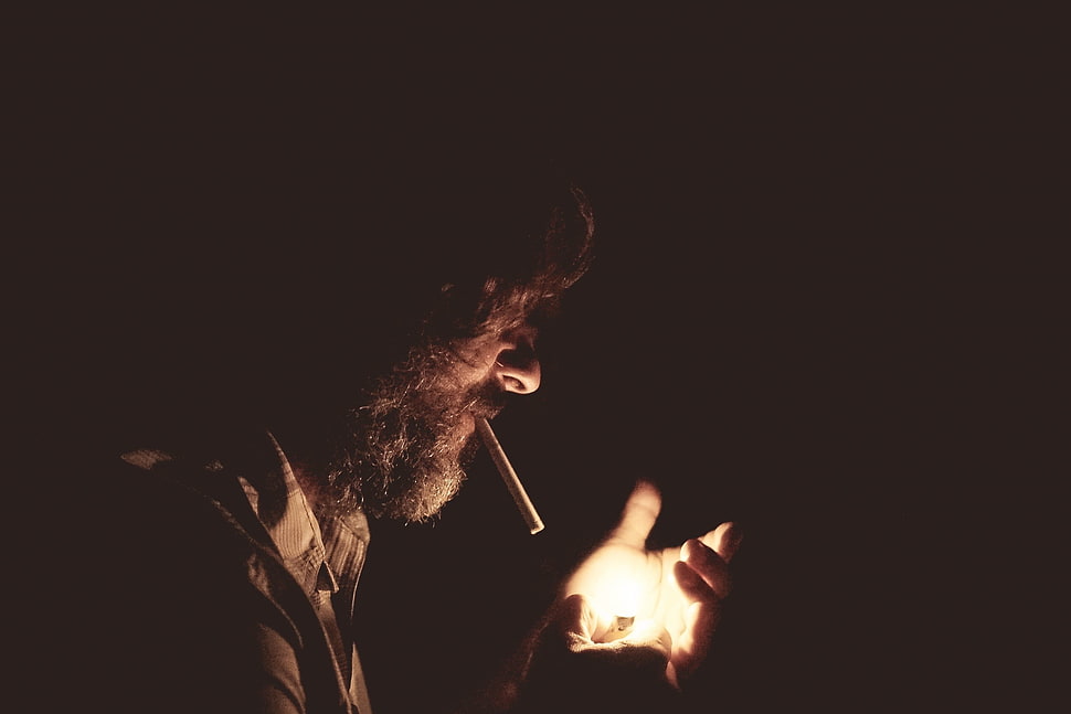man with cigarette holding lighter HD wallpaper