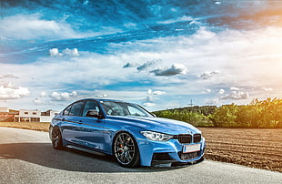 blue BMW 5-series sedan