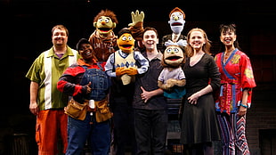group of people with puppets