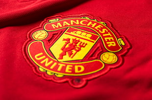 yellow nad red manchester united text HD wallpaper