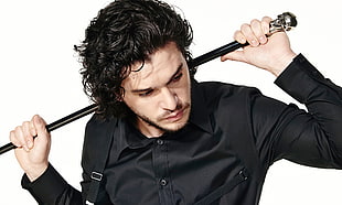 man in black button-up dress shirt and extender holding black rod HD wallpaper