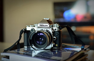 close up photo of gray vintage Nikon campact camera