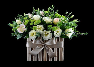 white roses with gray gift box
