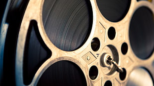 gray reel to reel projector, photography, closeup, depth of field, circle