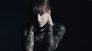 woman wearing black floral long sleeve top