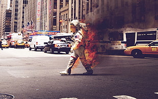 astronaut on fire crossing the street
