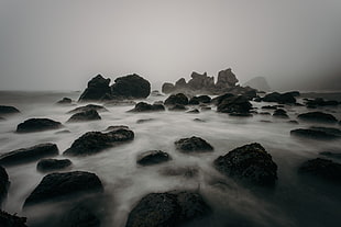 rocks with fogs during nighttime