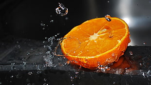 slice Orange Fruit with water splash and droplets HD wallpaper