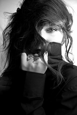 grayscale photo of woman covered by hair
