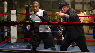 two men stances inside boxing ring