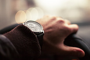 person left arm wearing silver round chronograph watch with black band HD wallpaper