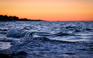 tilt shift photography of sea wave