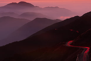 time-lapse photography of road beside mountains, hehuanshan